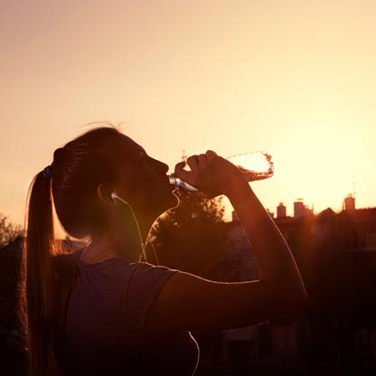 Drinking water at sunset